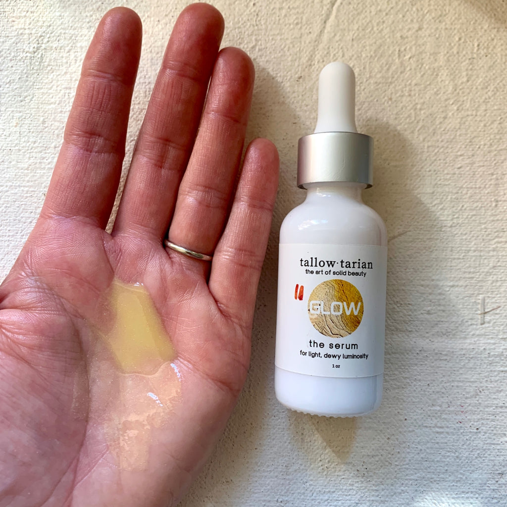 The Over All Glow Serum on palm