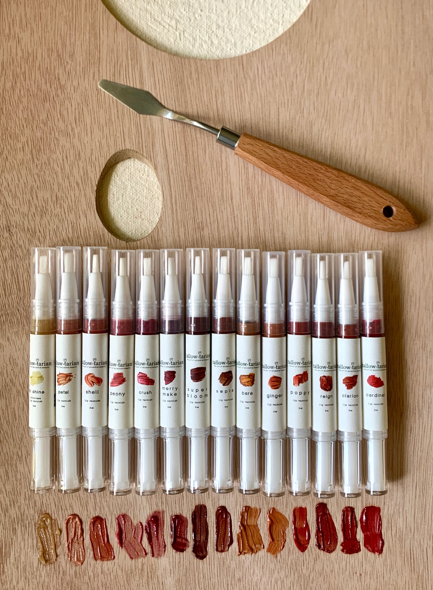 The Manifold Lip Varnish/Brush — full shade range with palette knife and swatches