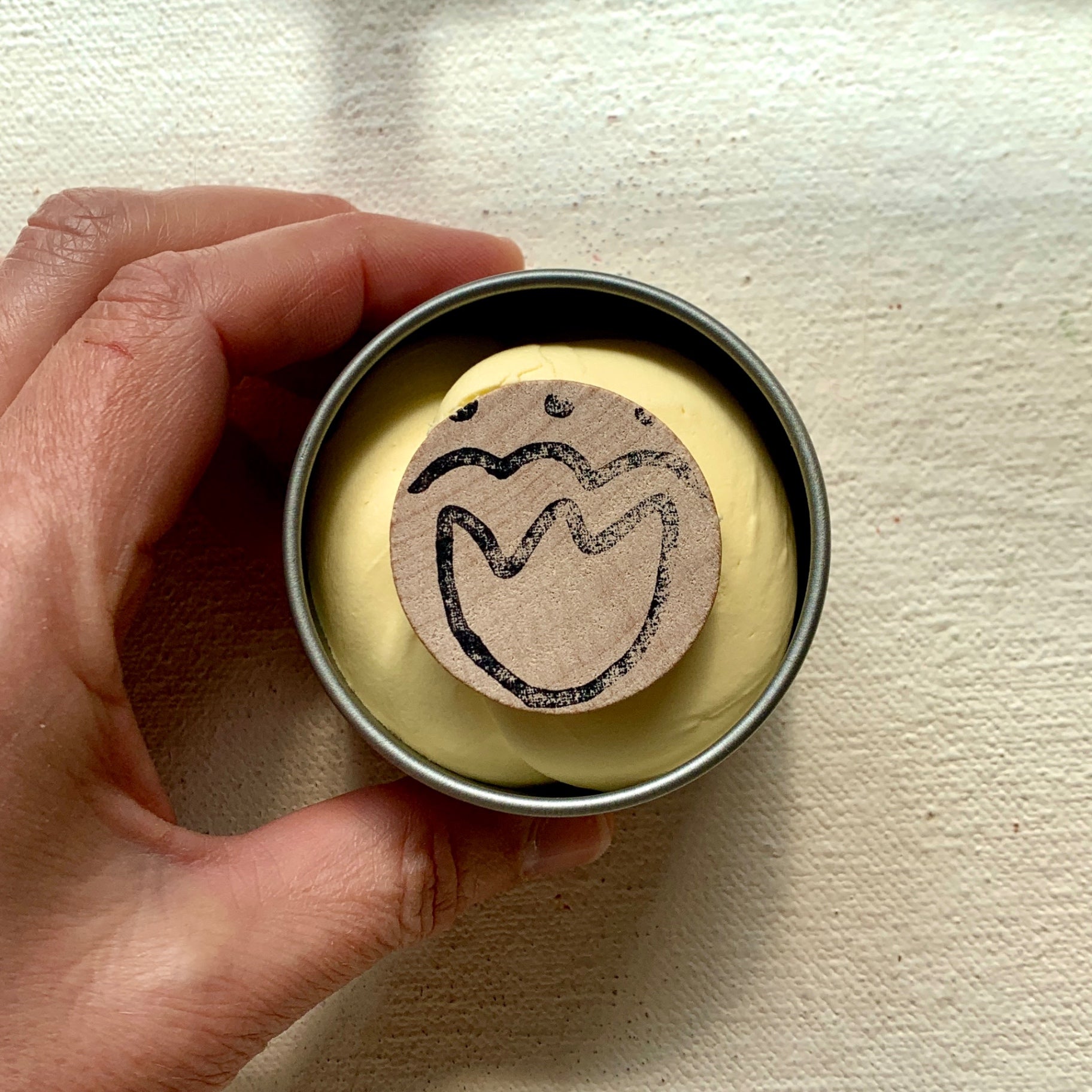 The Over All Paste open with wooden disc